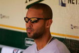 OAKLAND, CA - MAY 09:  Alex Rios #15 of the Toronto Blue Jays sits in the dugout before their game against the Oakland Athletics on May 9, 2009 at the Oakland Coliseum in Oakland, California.  (Photo by Ezra Shaw/Getty Images)