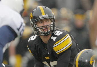 IOWA CITY, IOWA - NOVEMBER 8: Quarterback Ricky Stanzi #12 of the Iowa Hawkeyes calls a play at the line during the second quarter of play against the Penn State Nittany Lions at Kinnick Stadium on November 8, 2008 in Iowa City, Iowa. Iowa defeated Penn State  24-23. (Photo by David Purdy/Getty Images)