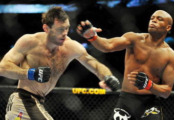 PHILADELPHIA - AUGUST 08:  Anderson Silva (R) throws a right punch to Forrest Griffin during their light heavyweight bout at UFC 101: Declaration at the Wachovia Center on August 8, 2009 in Philadelphia, Pennsylvania.  (Photo by Jon Kopaloff/Getty Images)