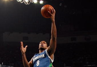 NEW ORLEANS - FEBRUARY 08:  Ryan Gomes #8 of the Minnesota Timberwolves  makes a shot over James Posey #41 and David West #30 of the New Orleans Hornets on February 8, 2009 in New Orleans, Louisiana.  NOTE TO USER: User expressly acknowledges and agrees that, by downloading and/or using this Photograph, user is consenting to the terms and conditions of the Getty Images License Agreement.  (Photo by Chris Graythen/Getty Images)