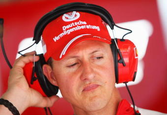 KUALA LUMPUR, MALAYSIA - APRIL 03:  Former Ferrari Formula One World Champion Michael Schumacher of Germany is seen in the Ferrari team garage during practice for the Malaysian Formula One Grand Prix at the Sepang Circuit on April 3, 2009 in Kuala Lumpur, Malaysia.  (Photo by Mark Thompson/Getty Images)