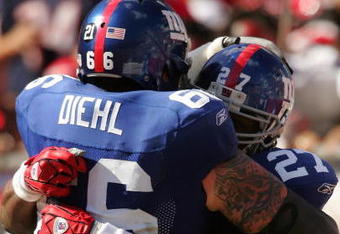 TAMPA, FL - JANUARY 06:  Brandon Jacobs #27 of the New York Giants celebrates his touchdown with teammate David Diehl #66 in the second quarter of the NFC Wild Card game against Tampa Bay Buccaneers making it 7-7 at Raymond James Stadium on January 6, 2008 in Tampa, Florida.  (Photo by Matthew Stockman/Getty Images)