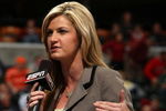 INDIANAPOLIS - MARCH 12:  ESPN's Erin Andrews performs an on camera report as the Michigan Wolveriens play against the Iowa Hawkeyes during the first round of the Big Ten Men's Basketball Tournament at Conseco Fieldhouse on March 12, 2009 in Indianapolis, Indiana.  (Photo by Jonathan Daniel/Getty Images)