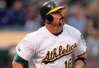 OAKLAND, CA - MAY 23:  Jason Giambi #16 of the Oakland Athletics watches his 400th career home run go over the outfield wall in the fourth inning of their game against the Arizona Diamondbacks at the Oakland Coliseum on May 23, 2009 in Oakland, California.  (Photo by Ezra Shaw/Getty Images)