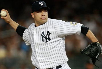 NEW YORK - AUGUST 10:  Alfredo Aceves #91 of the New York Yankees pitches during the game on August 10, 2009 at Yankee Stadium in the Bronx Borough of New York City. (Photo by Jared Wickerham/Getty Images)