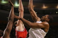 BOSTON - APRIL 18:  Leon Powe #0 of the Boston Celtics takes a shot over Brad Miller #52 and Tim Thomas #2 of the Chicago Bulls in Game One of the Eastern Conference Quarterfinals during the 2009 NBA Playoffs at TD Banknorth Garden on April 18, 2009 in Boston, Massachusetts. NOTE TO USER: User expressly acknowledges and agrees that, by downloading and or using this photograph, User is consenting to the terms and conditions of the Getty Images License Agreement. (Photo by Elsa/Getty Images)