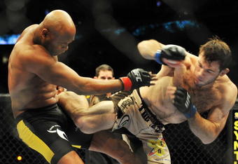 PHILADELPHIA - AUGUST 08:  (L-R) Anderson Silva battles  Forrest Griffin during their light heavyweight bout at UFC 101: Declaration at the Wachovia Center on August 8, 2009 in Philadelphia, Pennsylvania.  (Photo by Jon Kopaloff/Getty Images)