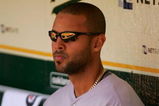 OAKLAND, CA - MAY 09:  Alex Rios #15 of the Toronto Blue Jays sits in the dugout before their game against the Oakland Athletics on May 9, 2009 at the Oakland Coliseum in Oakland, California.  (Photo by Ezra Shaw/Getty Images)