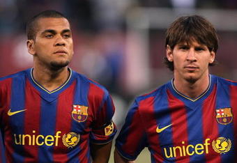 SAN FRANCISCO - AUGUST 08:  Dani Alvez #2 and Lionel Messi #10 of FC Barcelona line up before their game against Guadalajara Chivas during an international friendly match at Candlestick Park on August 8, 2009 in San Francisco, California.  (Photo by Jed Jacobsohn/Getty Images)