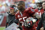 TAMPA, FL - NOVEMBER 30: Linebacker Derrick Brooks #55 of the Tampa Bay Buccaneers watches play against the New Orleans Saints at Raymond James Stadium on November 30, 2008 in Tampa, Florida.  (Photo by Al Messerschmidt/Getty Images) 