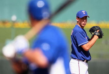 SURPRISE, AZ - MARCH 04:  Relief pitcher Derek Holland #67 of the Texas Rangers pitches against the Kansas City Royals during the spring training game at Surprise Stadium on March 4, 2009 in Surprise, Arizona. The Rangers defeated the Royals 5-3. (Photo by Christian Petersen/Getty Images)