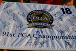 CHASKA, MN - AUGUST 11:  A fan holds a PGA Championship banner while waiting for autographs during the second preview day of the 91st PGA Championship at Hazeltine Golf Club on August 11, 2009 in Chaska, Minnesota.  (Photo by Scott Halleran/Getty Images)
