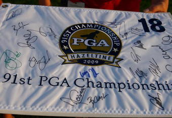 CHASKA, MN - AUGUST 11:  A fan holds a PGA Championship banner while waiting for autographs during the second preview day of the 91st PGA Championship at Hazeltine Golf Club on August 11, 2009 in Chaska, Minnesota.  (Photo by Scott Halleran/Getty Images)