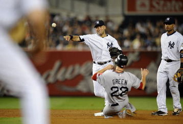 NEW YORK - AUGUST 09:  Derek Jeter #2  of the New York Yankees throws to first after forcing out Nick Green #22 of the Boston Red Sox in the third inning on August 9, 2009 at Yankee Stadium in the Bronx Borough of New York City.  Robinson Cano #24 of the New York Yankees looks on at right. (Photo by Jeff Zelevansky/Getty Images)
