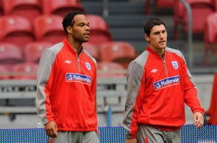 AMSTERDAM, NETHERLANDS - AUGUST 11:  Joleon Lescott walks with Gareth Barry during the England Training Session at the Amsterdam Arena on August 11, 2009 in Amsterdam, Netherlands.  (Photo by Michael Regan/Getty Images)