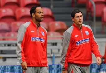 AMSTERDAM, NETHERLANDS - AUGUST 11:  Joleon Lescott walks with Gareth Barry during the England Training Session at the Amsterdam Arena on August 11, 2009 in Amsterdam, Netherlands.  (Photo by Michael Regan/Getty Images)