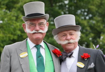 ASCOT, ENGLAND - JUNE 17:  Two men with handlebar moustaches pose for photographs on the second day of Royal Ascot 2009 at Ascot Racecourse on June 17, 2009 in Ascot, England.  (Photo by Chris Jackson/Getty Images)