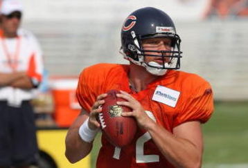 BOURBONNAIS, IL - AUGUST 04: Caleb Hanie #12 of the Chicago Bears drops back to pass during a training camp practice on August 4, 2009 at Olivet Nazarene University in Bourbonnais, Illinois. (Photo by Jonathan Daniel/Getty Images)
