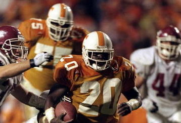 14 Nov 1998:  Travis Henry #20 of the Tennessee Volunteers runs with the ball during a game against the Arkansas Razorbacks at the Neyland Stadium in Knoxville, Tennessee. The Volunteers defeated the Razorbacks 28-24. Mandatory Credit: Tom Hauck  /Allsport