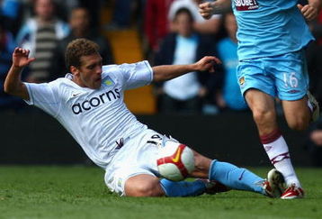 BIRMINGHAM, ENGLAND - APRIL 18:  Stiliyan Petrov (L) of Aston Villa tackles Mark Noble (R) of West Ham during the Barclays Premier League match between Aston Villa and West Ham United at Villa Park on April 18, 2009 in Birmingham, England.  (Photo by Ryan Pierse/Getty Images)