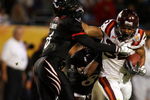 MIAMI - JANUARY 01:  DeAngelo Smith #6 of the Cincinnati Bearcats tries to tackle Darren Evans #32 of the Virginia Tech Hokies during the FedEx Orange Bowl at Dolphin Stadium on January 1, 2009 in Miami, Florida.  (Photo by Doug Benc/Getty Images)