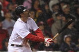 BOSTON - JUNE 11: Mike Lowell #25 of the Boston Red Sox hits a sacrifice fly to knock in the winning run to beat the New York Yankees, 4-3, at Fenway Park on June 11, 2009 in Boston, Massachusetts.  (Photo by Jim Rogash/Getty Images)