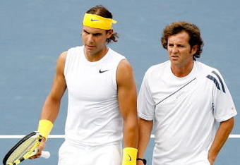 MONTREAL, QC - AUGUST 10:  Rafael Nadal and Francisco Roig of Spain confer between points while playing Novak Djokovic and Dusan Vemic of Serbia during the Rogers Cup at Uniprix Stadium on August 10, 2009 in Montreal, Canada.  (Photo by Matthew Stockman/Getty Images)