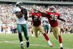 PHILADELPHIA - SEPTEMBER 18:  Terrell Owens #81 of the Philadelphia Eagles catches a pass for a touchdown as Mike Rumph #24 and Shawntae Spencer #36 of the San Francisco 49ers defend during the first half of the game on September 18, 2005 at Lincoln Financial Field in Philadelphia, Pennsylvania.  (Photo by Jamie Squire/Getty Images)