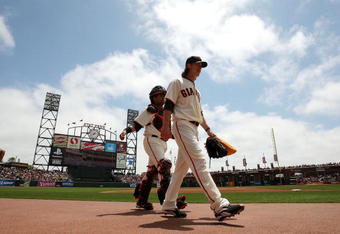SAN FRANCISCO - JUNE 17:  Tim Lincecum #55 and Bengie Molina #1 of the San Francisco Giants walk in from the bullpen before the start of a game against the Los Angeles Angels of Anaheim at AT&T Park on June 17, 2009 in San Francisco, California.  (Photo by Ezra Shaw/Getty Images)