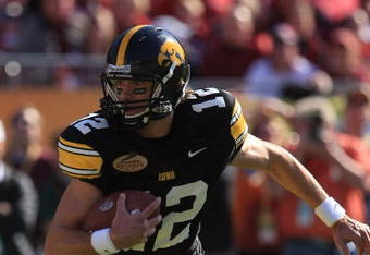 TAMPA, FL - JANUARY 01:  Ricky Stanzi #12 of the Iowa Hawkeyes runs upfield against the South Carolina Gamecocks during the Outback Bowl on January 1, 2009 at Raymond James Stadium in Tampa, Florida.  (Photo by Scott Halleran/Getty Images)