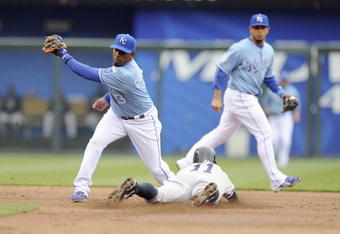 KANSAS CITY, MO - APRIL 12:  Alberto Callaspo #13 of the Kansas City Royals tags out Brett Gardner #11 of the New York Yankees on April 12, 2009 at Kauffman Stadium in Kansas City, Missouri. (Photo by G. Newman Lowrance/Getty Images)