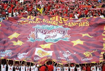 SINGAPORE - JULY 26:  SINGAPORE- JULY 26:  Liverpool's fans cheer before the pre-season friendly soccer match between Singapore and Liverpool at the National Stadium, July 26, 2009 in Singapore.  (Photo by Victor Fraile/Getty Images)