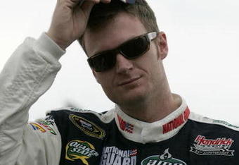 WATKINS GLEN, NY - AUGUST 09:  Dale Earnhardt Jr., driver of the #88 National Guard/AMP Energy Chevrolet, stands on the grid prior to the NASCAR Sprint Cup Series Heluva Good! Sour Cream Dips at Watkins Glen International on August 9, 2009 in Watkins Glen, New York.  (Photo by Todd Warshaw/Getty Images for NASCAR)