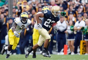 SOUTH BEND,IN - SEPTEMBER 13:  Golden Tate #23 of the Notre Dame Fighting Irish carries the ball during the game against the Michigan Wolverines on September 13, 2008 at Notre Dame Stadium in South Bend, Indiana. (Photo by: Gregory Shamus/Getty Images)