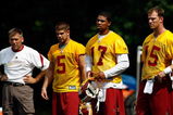 ASHBURN, VA - JULY 30:  Washington Redskins Head Coach Jim Zorn (L) works with quarterbacks Jason Campbell #17, Colt Brennan #5 and Todd Collins #15 during opening day of training camp July 30, 2009 in Ashburn, Virginia.  (Photo by Win McNamee/Getty Images)