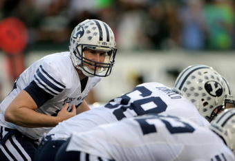 FORT COLLINS, CO - NOVEMBER 01:  Quaterback Max Hall #15 of the Brigham Young Cougars runs the offense against the Colorado State Rams at Sonny Lubick Field at Hughes Stadium on November 1, 2008 in Fort Collins, Colorado. BYU defeated CSU 45-42.  (Photo by Doug Pensinger/Getty Images)