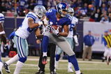 EAST RUTHERFORD, NJ - NOVEMBER 02:  Steve Smith #12 of the New York Giants scores a touchdown as Orlando Scandrick #32 of the Dallas Cowboys defends during their game on November 2, 2008 at Giants Stadium in East Rutherford, New Jersey.  (Photo by Al Bello/Getty Images)