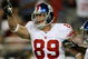 GLENDALE, AZ - NOVEMBER 23: Tight end Kevin Boss #89 of the New York Giants celebrates after scoring on a ten yard touchdown pass play against the Arizona Cardinals on November 23, 2008 at University of Phoenix Stadium in Glendale, Arizona. The Giants won 37-29. (Photo by Stephen Dunn/Getty Images)