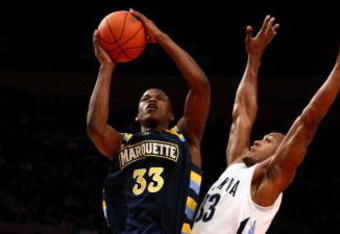 NEW YORK - MARCH 12:  Dante Cunningham #33 of the Villanova Wildcats goes to the hoop against Jimmy Butler #33 of the Marquette Golden Eagles during the second round of the Big East Tournament at Madison Square Garden on March 12, 2009 in New York City.  (Photo by Chris McGrath/Getty Images)