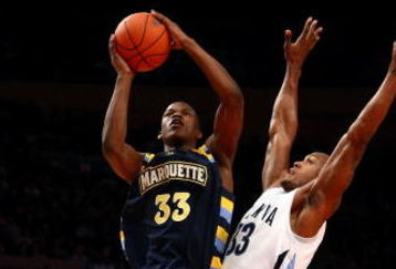 NEW YORK - MARCH 12:  Dante Cunningham #33 of the Villanova Wildcats goes to the hoop against Jimmy Butler #33 of the Marquette Golden Eagles during the second round of the Big East Tournament at Madison Square Garden on March 12, 2009 in New York City.  (Photo by Chris McGrath/Getty Images)