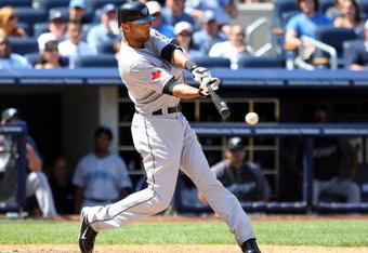 NEW YORK - JULY 06:  Alex Rios #15 of the Toronto Blue Jays bats against the New York Yankees on July 6, 2009 at Yankee Stadium in the Bronx borough of New York City.  (Photo by Jim McIsaac/Getty Images)