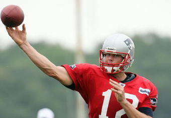 FOXBORO, MA - JULY 31:  Quarterback Tom Brady #12 of the New England Patriots passes the ball during training camp on July 31, 2009 at Gillette Stadium in Foxboro, Massachusetts.  (Photo by Elsa/Getty Images)