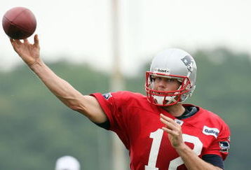 FOXBORO, MA - JULY 31:  Quarterback Tom Brady #12 of the New England Patriots passes the ball during training camp on July 31, 2009 at Gillette Stadium in Foxboro, Massachusetts.  (Photo by Elsa/Getty Images)