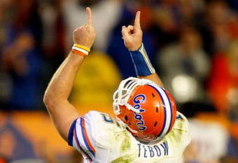 MIAMI - JANUARY 08:  Tim Tebow #15 of the Florida Gators celebrates after he threw a 4-yard touchdown to David Nelson #83 in the fourth quarter against the Oklahoma Sooners during the FedEx BCS National Championship game at Dolphin Stadium on January 8, 2009 in Miami, Florida. FLorida won 24-17. (Photo by Marc Serota/Getty Images)
