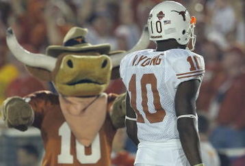 PASADENA, CA - JANUARY 04:  Quarterback Vince Young #10 of the Texas Longhorns walks past the Longhorns' mascot near the start of the BCS National Championship Rose Bowl Game against the USC Trojans at the Rose Bowl on January 4, 2006 in Pasadena, California.  Texas defeated USC 41-38.  (Photo by Lisa Blumenfeld/Getty Images)