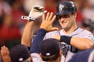 ANAHEIM, CA - APRIL 24: Russell Branyan #30 of the Seattle Mariners high-fives teamates in the dugout after hitting a home run in the second inning against the Los Angeles Angels of Anaheim on April 24, 2009 at Angel Stadium in Anaheim, California. (Photo by Stephen Dunn/Getty Images)