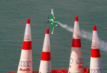 DETROIT - JUNE 12:  Michael Goulian flies through a gate during a practice session for the 2009 Windsor, Ontario Red Bull Air Race on June 12, 2009 at the Detroit River in Detroit, Michigan.  (Photo by Kevin C. Cox/Getty Images)