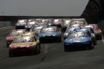 WATKINS GLEN, NY - AUGUST 10:  Marcos Ambrose, driver of the #47 Little Debbie/Kingsford/Clorox Toyota, leads a group of cars during the NASCAR Sprint Cup Series Heluva Good! Sour Cream Dips at Watkins Glen International on August 10, 2009 in Watkins Glen, New York.  (Photo by Chris Trotman/Getty Images for NASCAR)