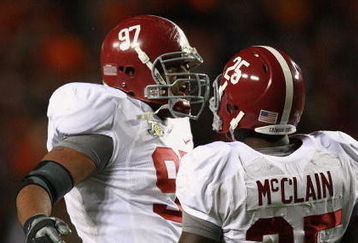 AUBURN, AL - NOVEMBER 24:  Defensive lineman Lorenzo Washington #97 and Rolando McClain #25 of the Alabama Crimson Tide celebrate after sacking quarterback Brandon Cox #12 of the Auburn Tigers at Jordan-Hare Stadium on November 24, 2007 in Auburn, Alabama. (Photo by Doug Benc/Getty Images)