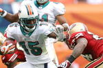 MIAMI - DECEMBER 14:  Wide receiver Davone Bess #15 of the Miami Dolphins breaks through for extra yardage on a kick return while taking on the San Francisco 49ers at Dolphin Stadium on December 14, 2008 in Miami, Florida. The Dolphins defeated the 49ers 14-9.  (Photo by Doug Benc/Getty Images)